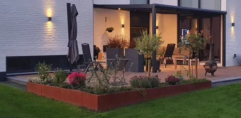 Creëer sfeer met cortenstaal in de tuin